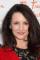 Kristin Davis as Ginny Taylor-Clapp