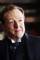 Edward Hibbert as Sir Michael Strickland