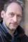 Eric Colvin as Sykes