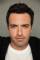 Reid Scott as 