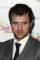 Jonas Armstrong as Elek Cohen