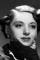 Elaine Barrie as 
